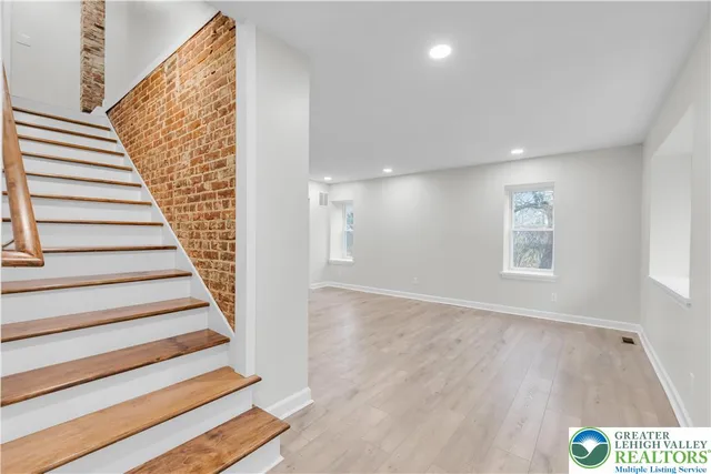 a view of entryway with wooden floor