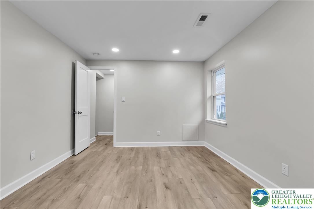 4453 Old Bethlehem Pike Center Valley, PA 18034 - Photo 16 of 28 a view of hallway with a window and wooden floor