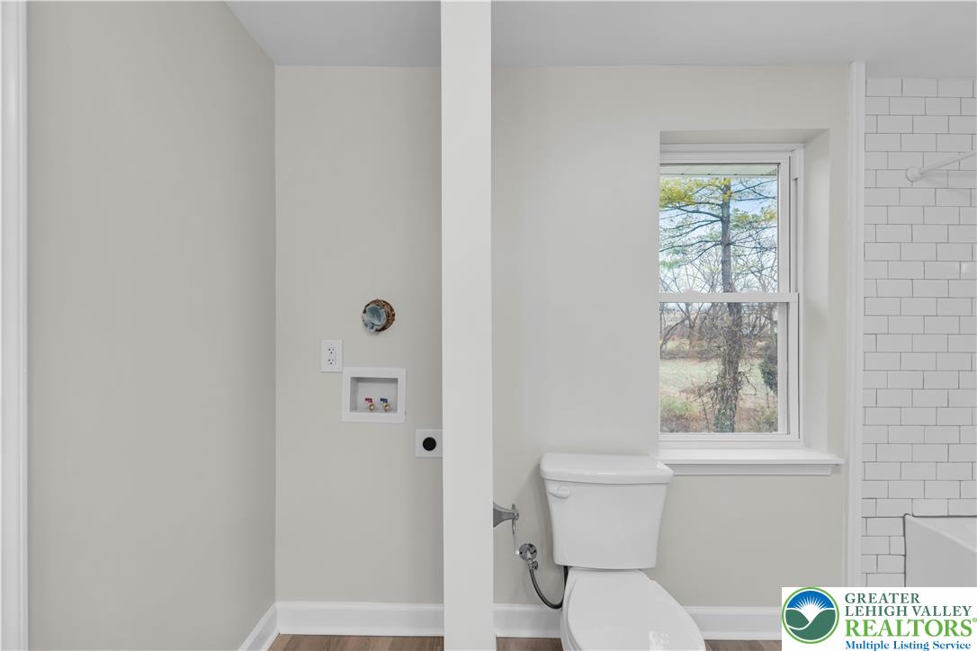 4453 Old Bethlehem Pike Center Valley, PA 18034 - Photo 20 of 28 a white toilet sitting next to a bathroom sink