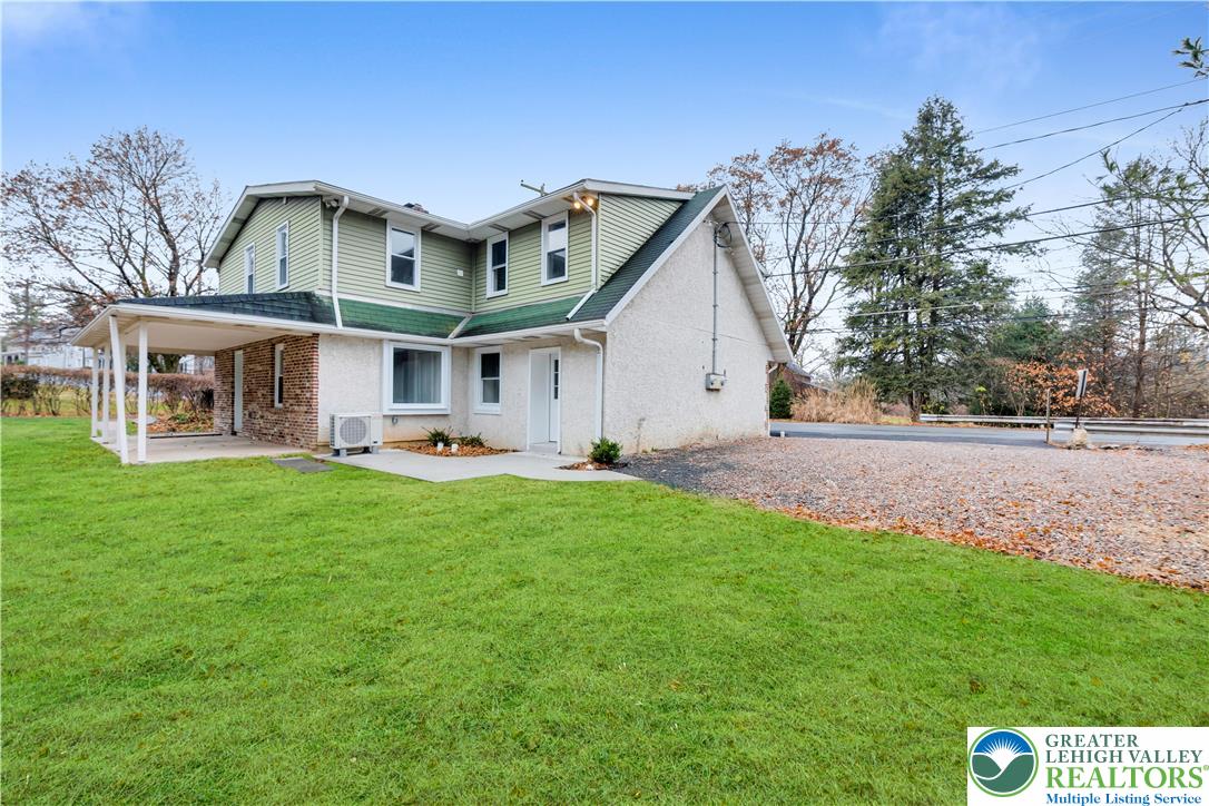 4453 Old Bethlehem Pike Center Valley, PA 18034 - Photo 2 of 28 a view of a big house with a big yard and large trees