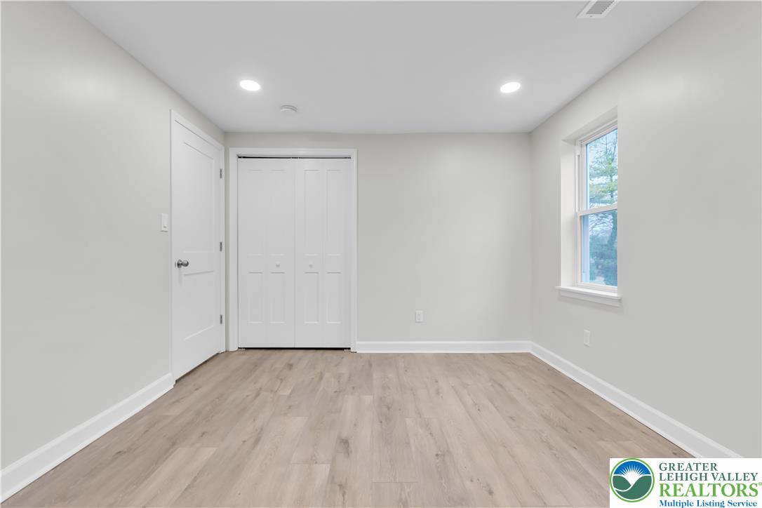 4453 Old Bethlehem Pike Center Valley, PA 18034 - Photo 22 of 28 wooden floor in an empty room with a window
