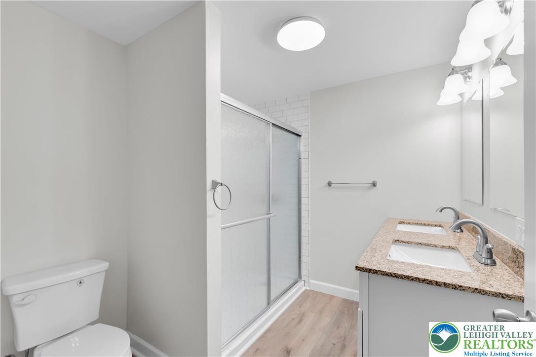 4453 Old Bethlehem Pike Center Valley, PA 18034 - Photo 24 of 28 a bathroom with a granite countertop sink toilet and shower