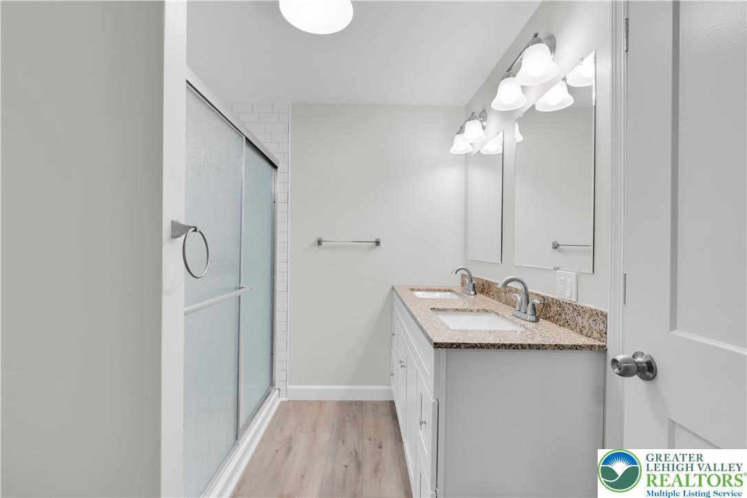 4453 Old Bethlehem Pike Center Valley, PA 18034 - Photo 25 of 28 a bathroom with a sink vanity and a mirror