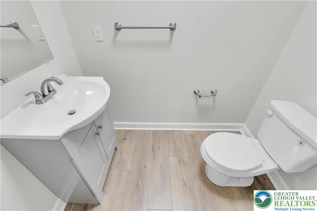 a bathroom with a toilet and a sink