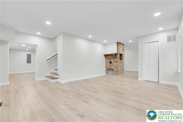 a view of kitchen with refrigerator and window