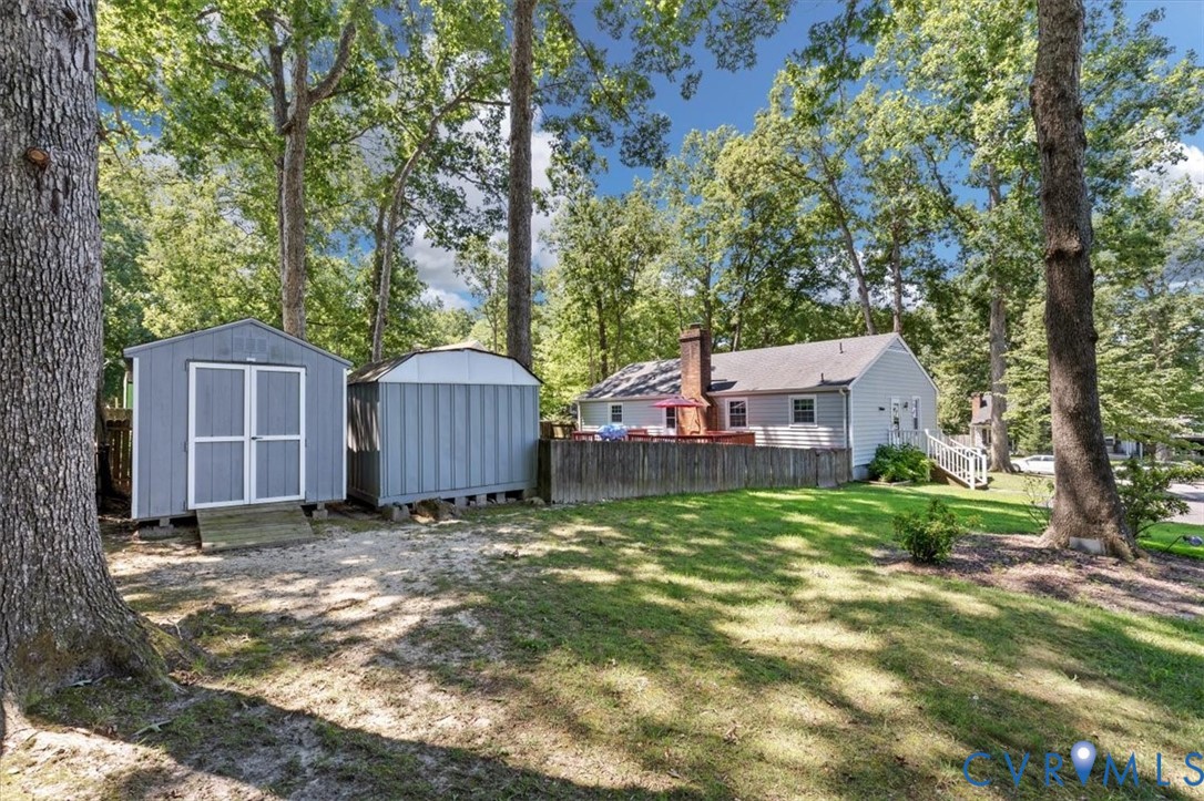 9907 Indian Point Road North Chesterfield, VA 23237 - Photo 19 of 21 Expansive backyard featuring two storage sheds, a