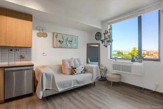 a kitchen with stainless steel appliances a stove a sink and a microwave