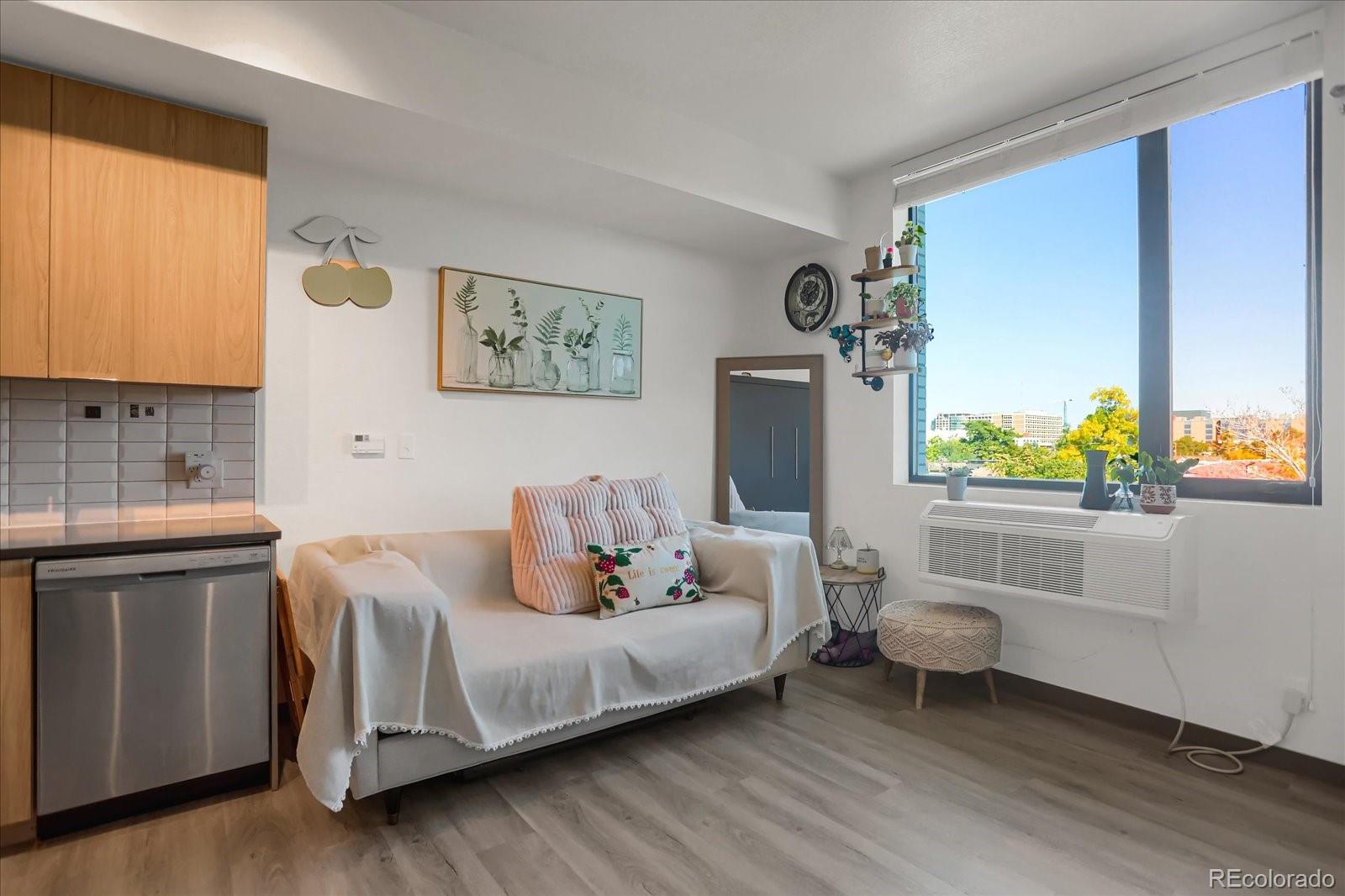 603 Inca Street, Unit 423 Denver, CO 80204 - Photo 6 of 20 a bedroom with a bed and a window