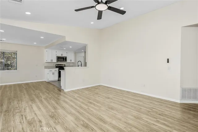 a kitchen with granite countertop a sink and a stove top oven