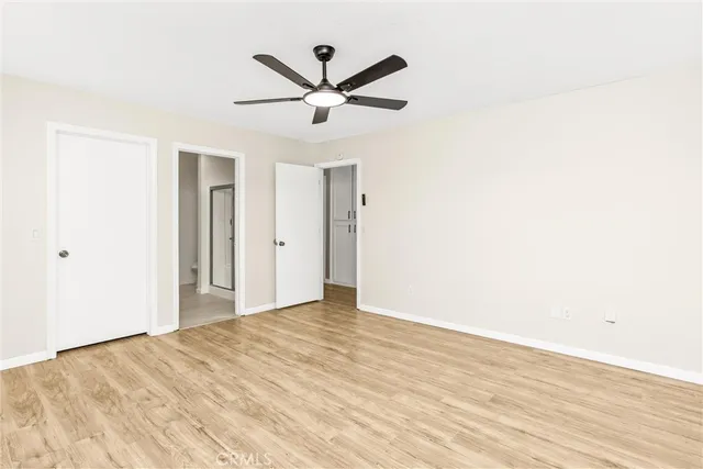 a spacious bathroom with a double vanity sink a mirror and a bathtub