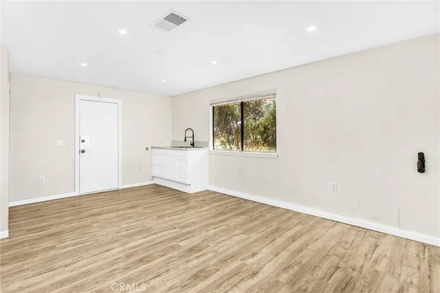 a view of small space with wooden floor