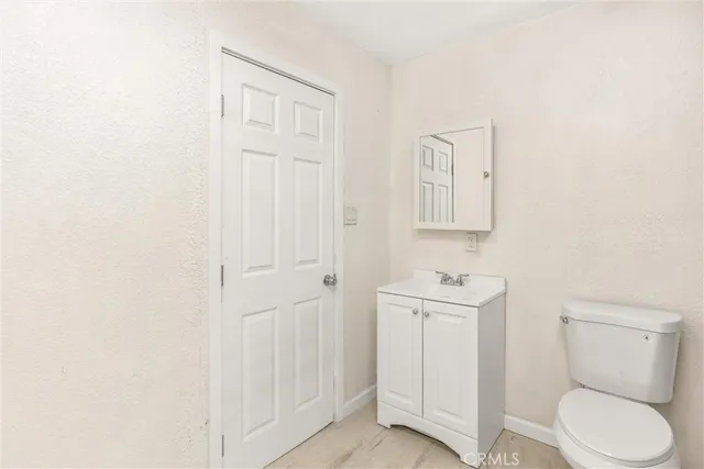 a view of a porch with furniture and floor to ceiling window