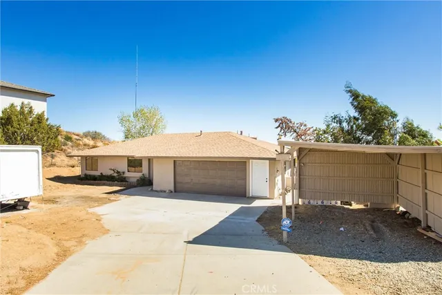 a view of a hallway with wooden floor and closet area