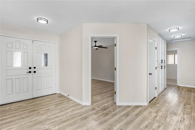 a view of kitchen with microwave and wooden floor