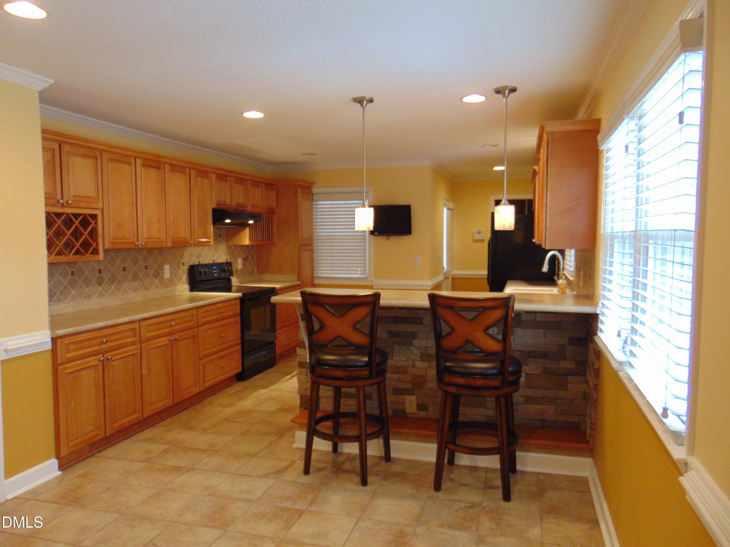 442 Gus Road Durham, NC 27703 - Photo 11 of 56 a kitchen with a table and chairs in it