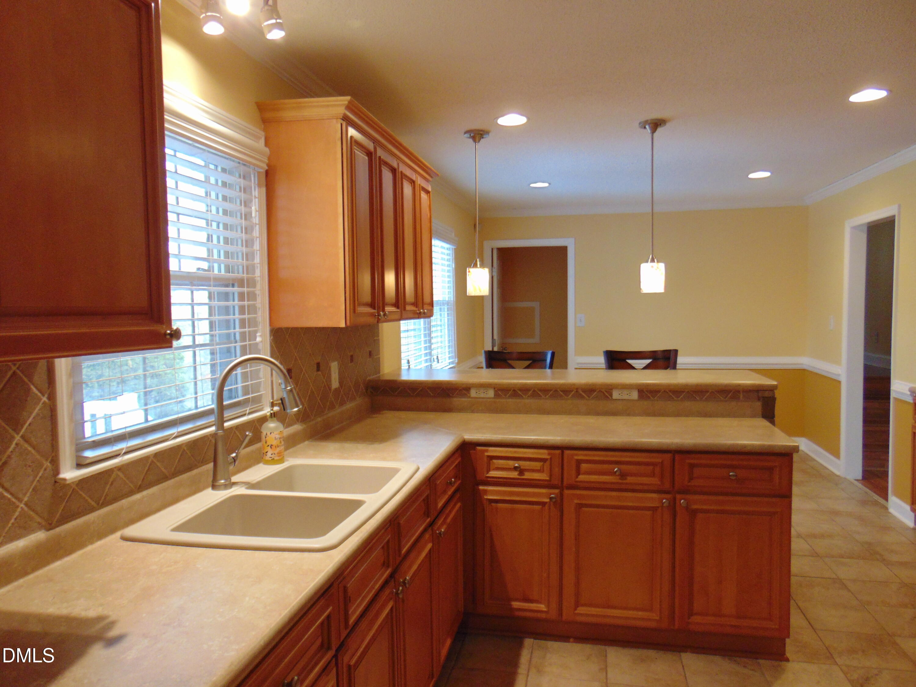 442 Gus Road Durham, NC 27703 - Photo 13 of 56 a bathroom with a granite countertop sink and a large mirror