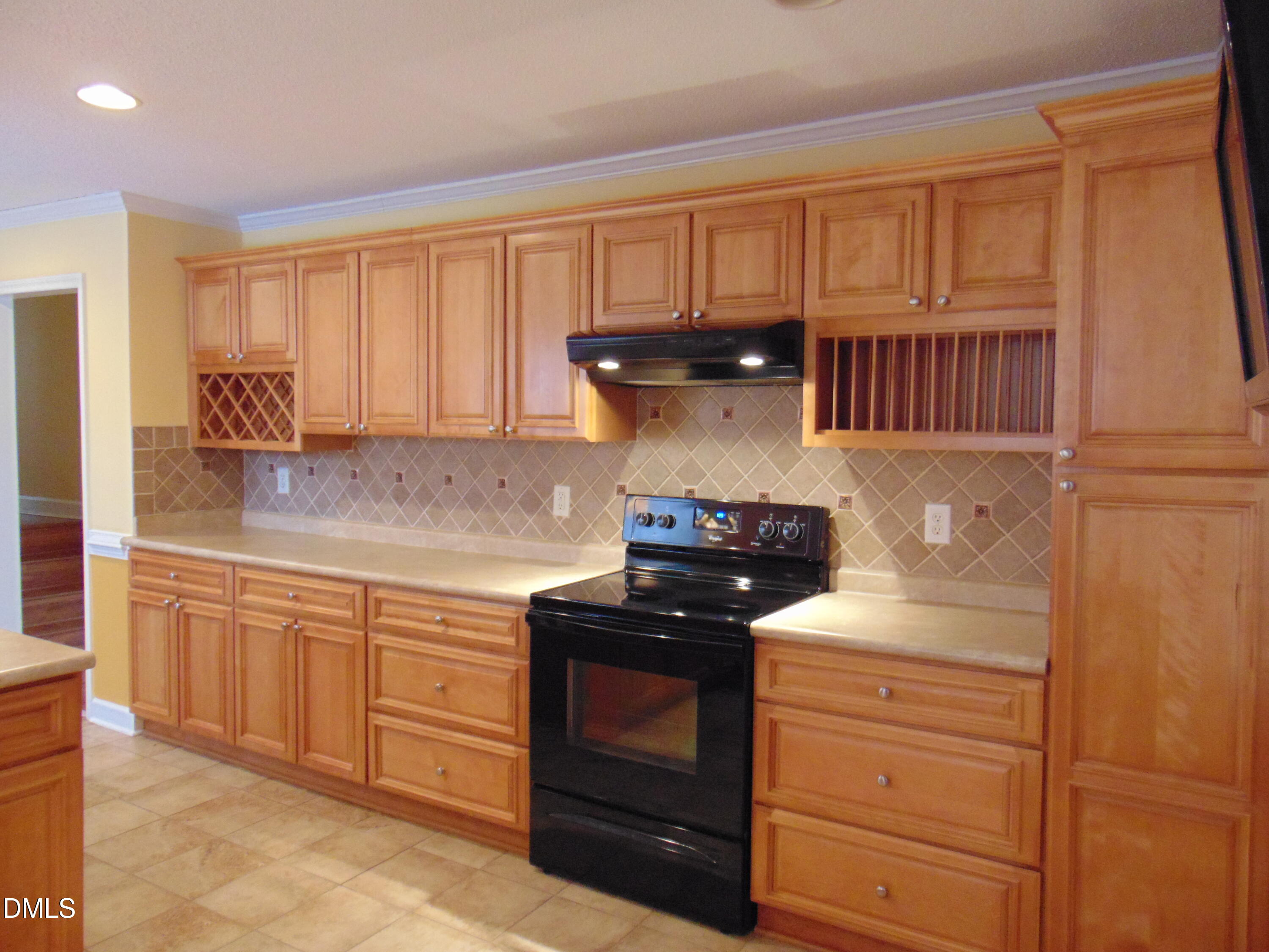 442 Gus Road Durham, NC 27703 - Photo 14 of 56 a kitchen with granite countertop a stove and a sink