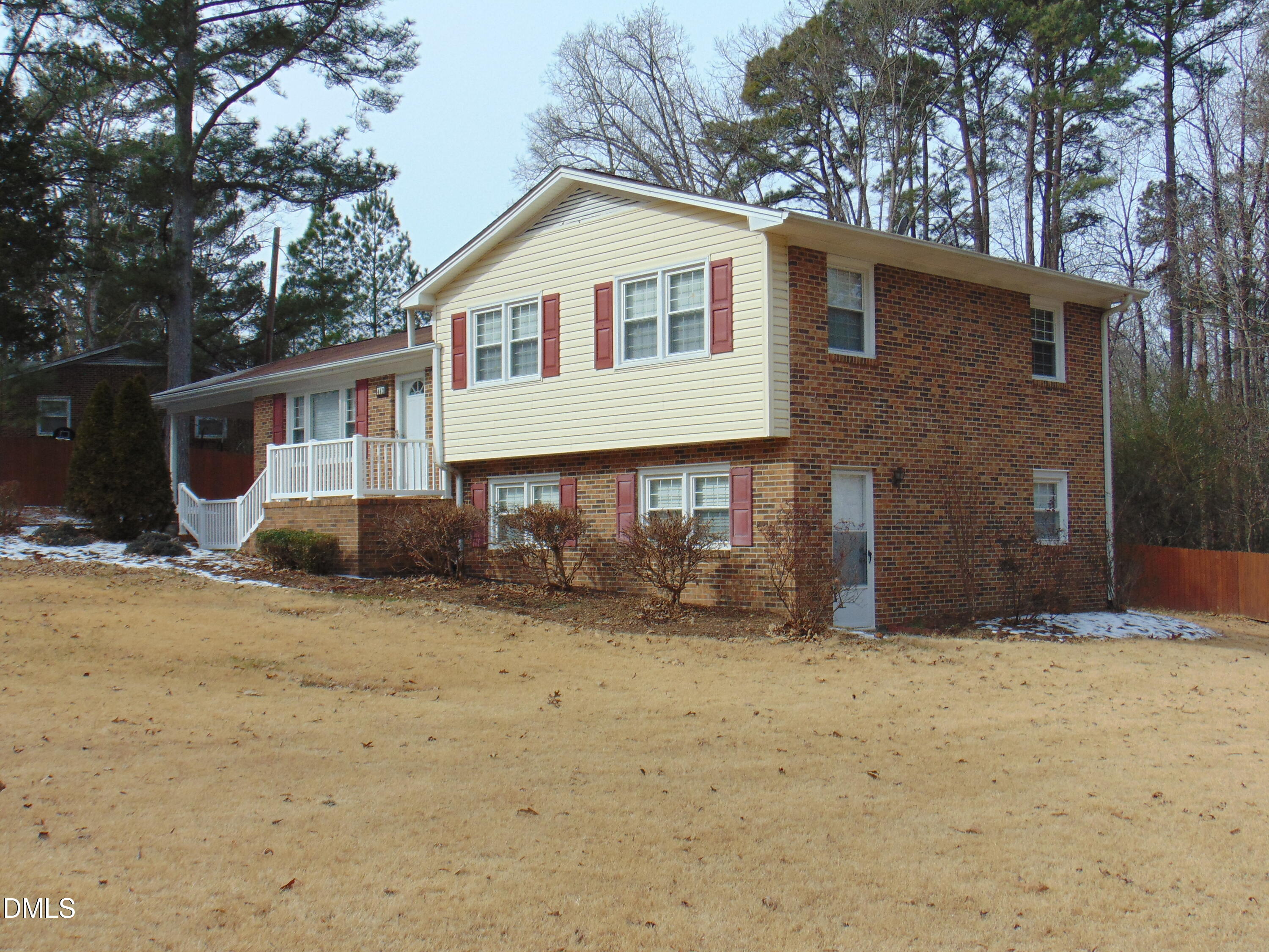 442 Gus Road Durham, NC 27703 - Photo 2 of 56 a front view of a house with a yard covered in snow