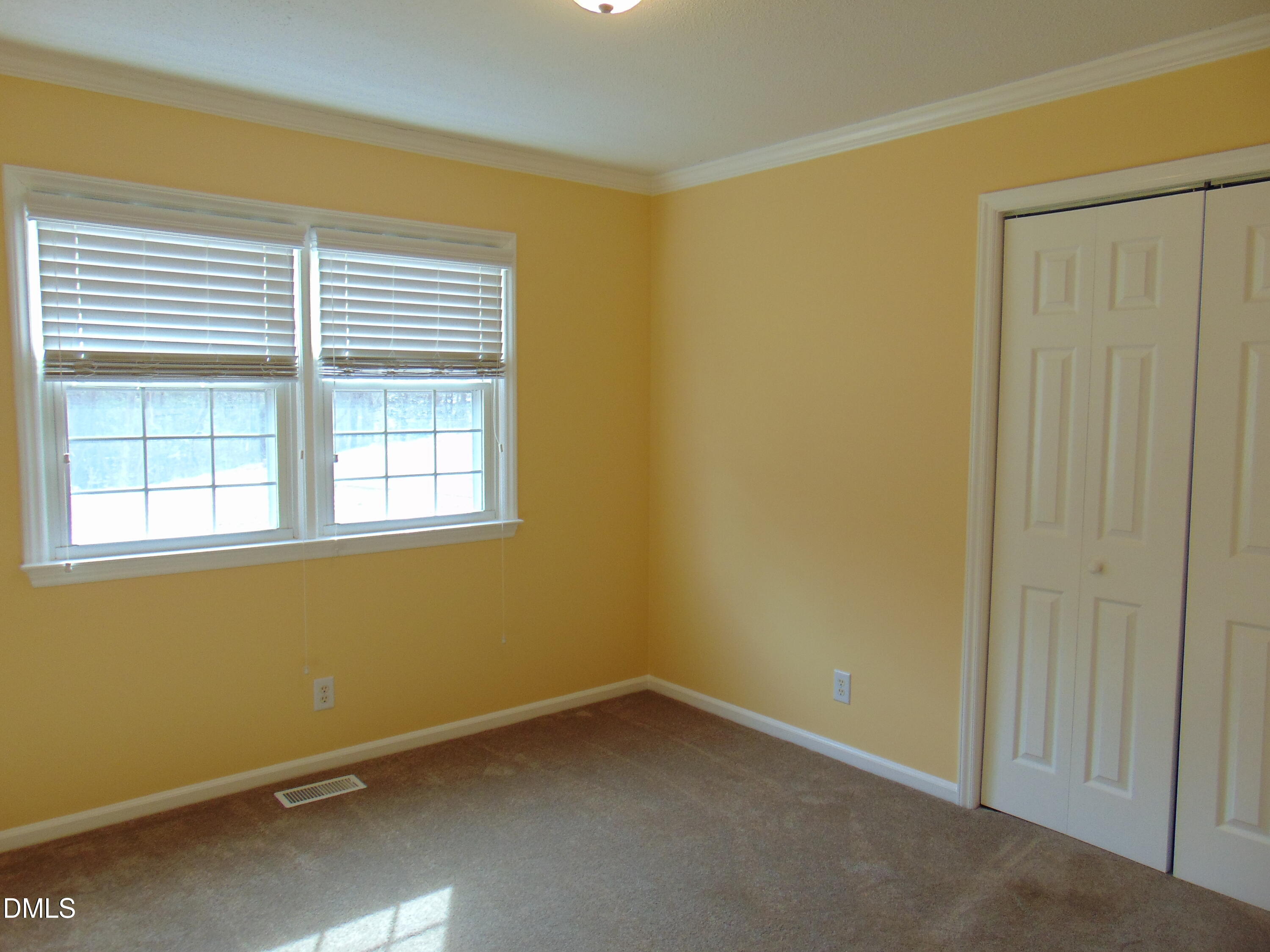 442 Gus Road Durham, NC 27703 - Photo 22 of 56 an empty room with a window