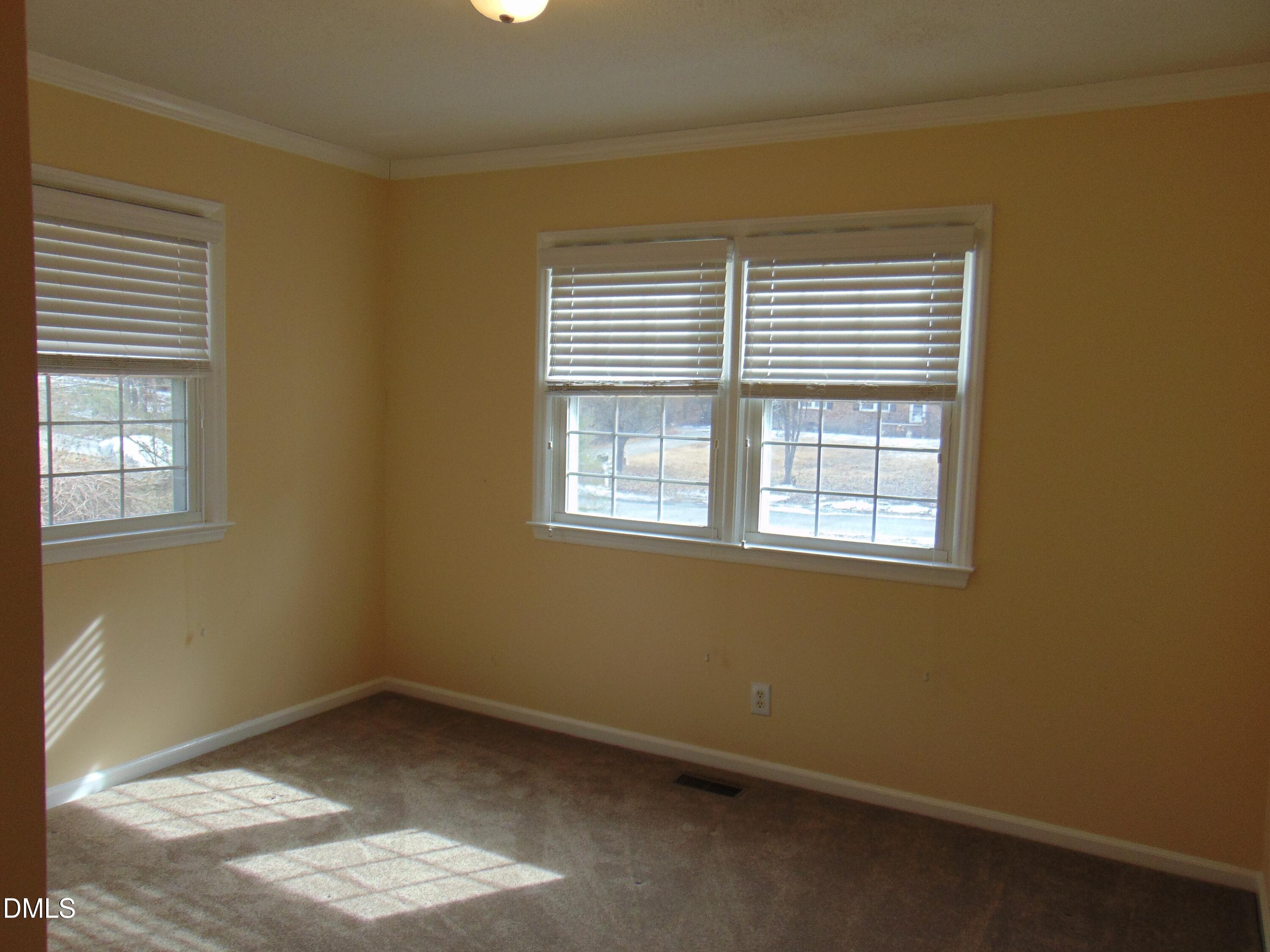 442 Gus Road Durham, NC 27703 - Photo 26 of 56 a view of an empty room with a window