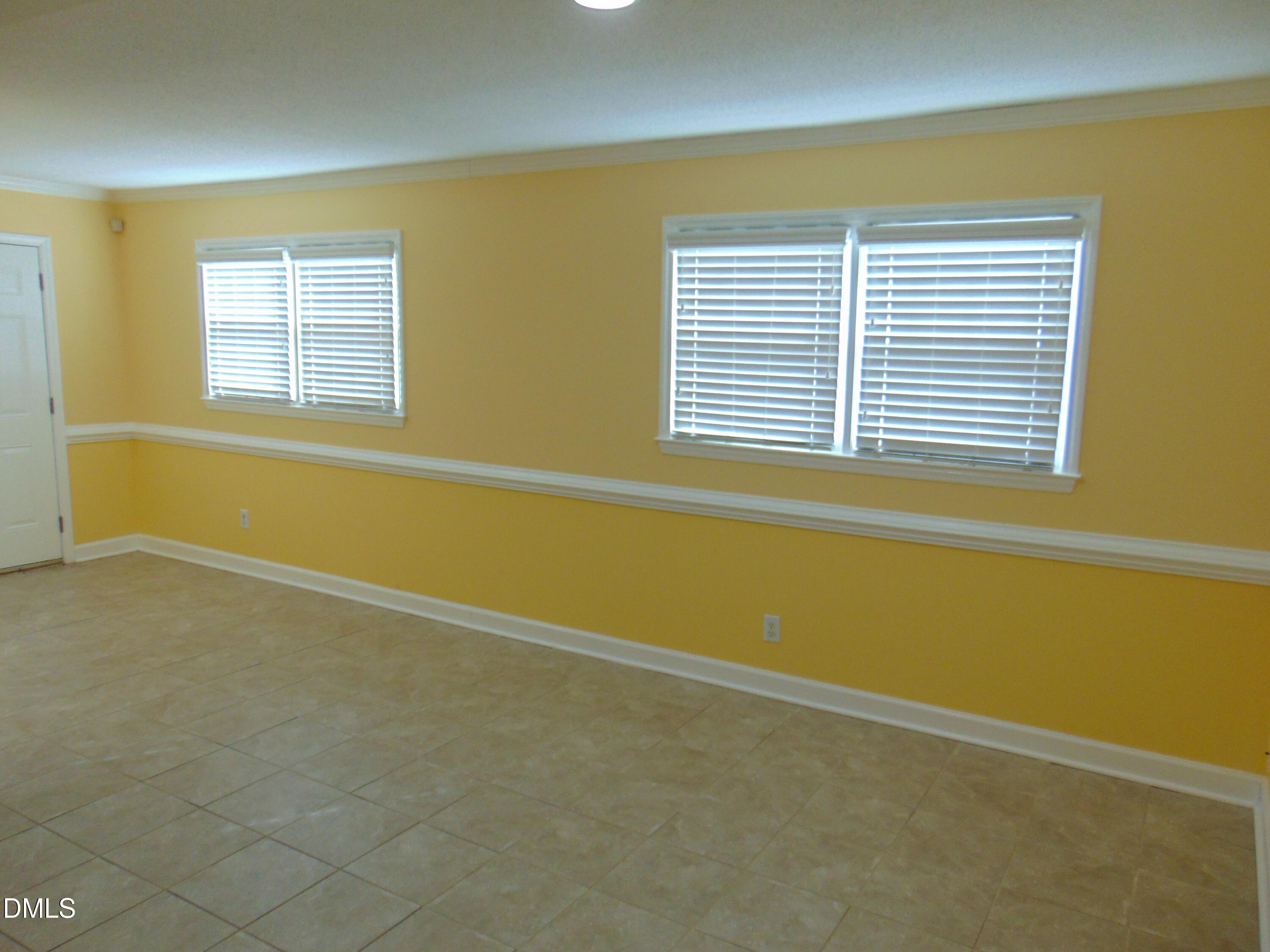 442 Gus Road Durham, NC 27703 - Photo 33 of 56 a view of an empty room with a window