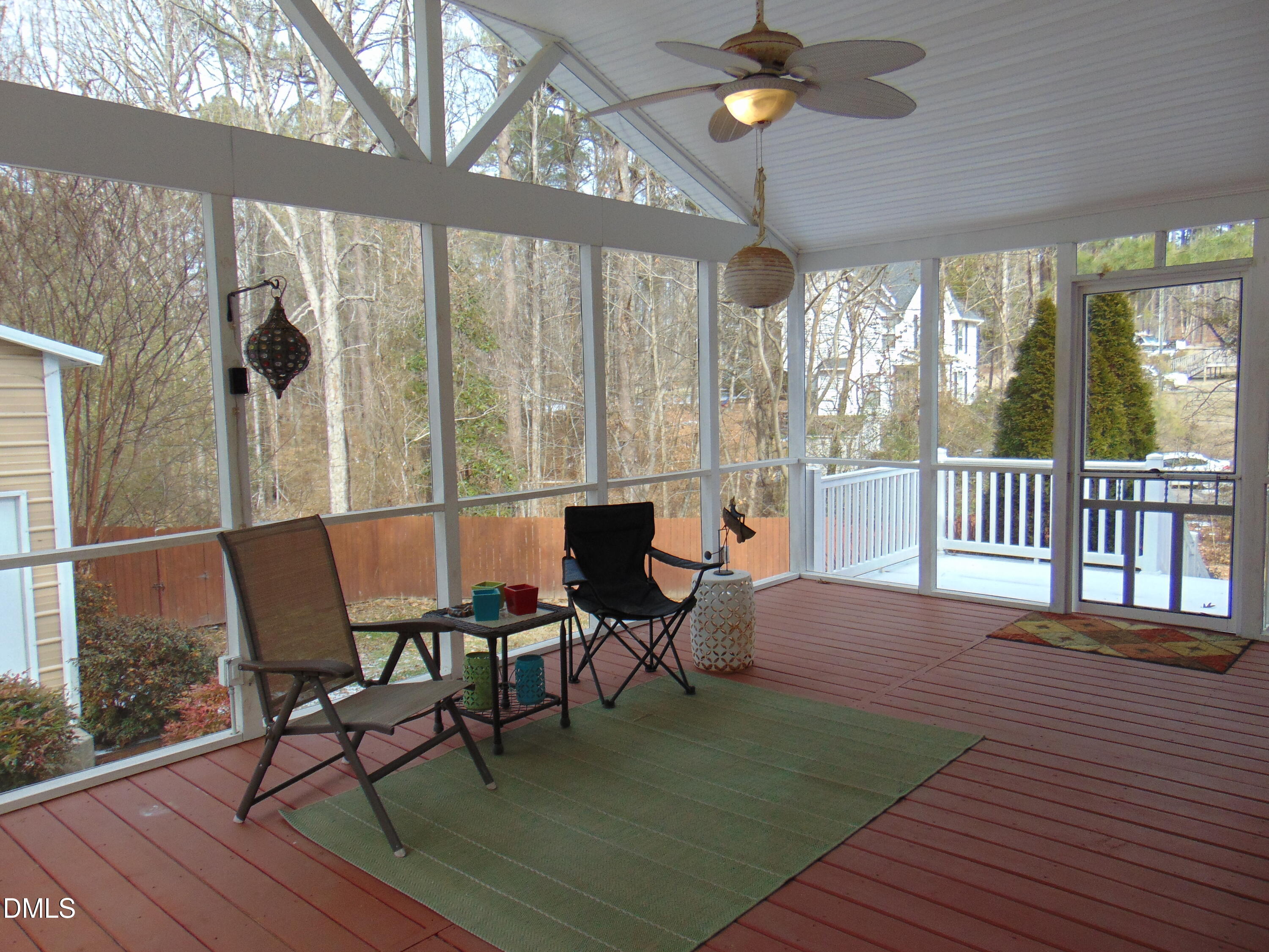442 Gus Road Durham, NC 27703 - Photo 46 of 56 a dining room with wooden floor glass table and chairs