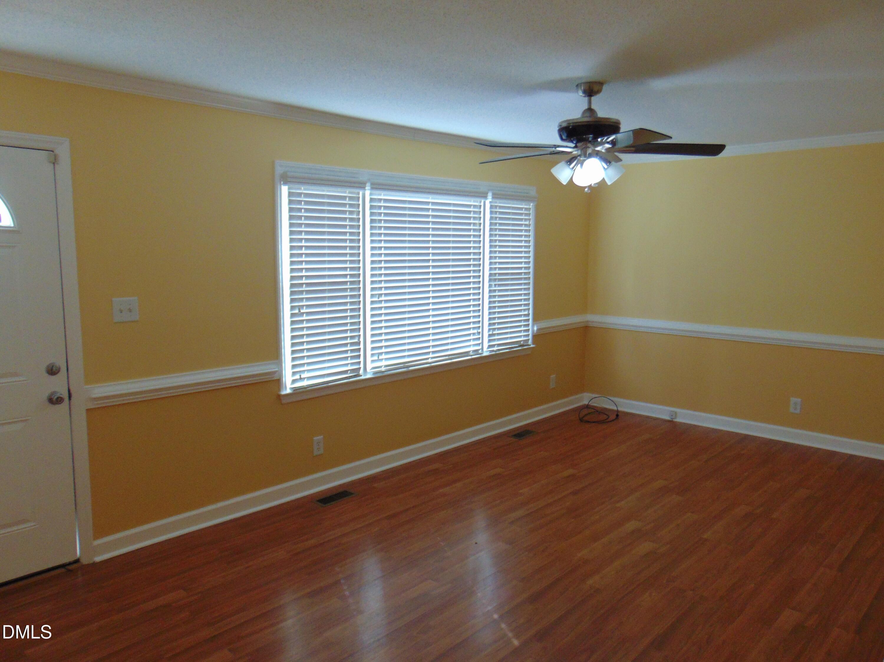 442 Gus Road Durham, NC 27703 - Photo 5 of 56 a view of a room with wooden floor and windows