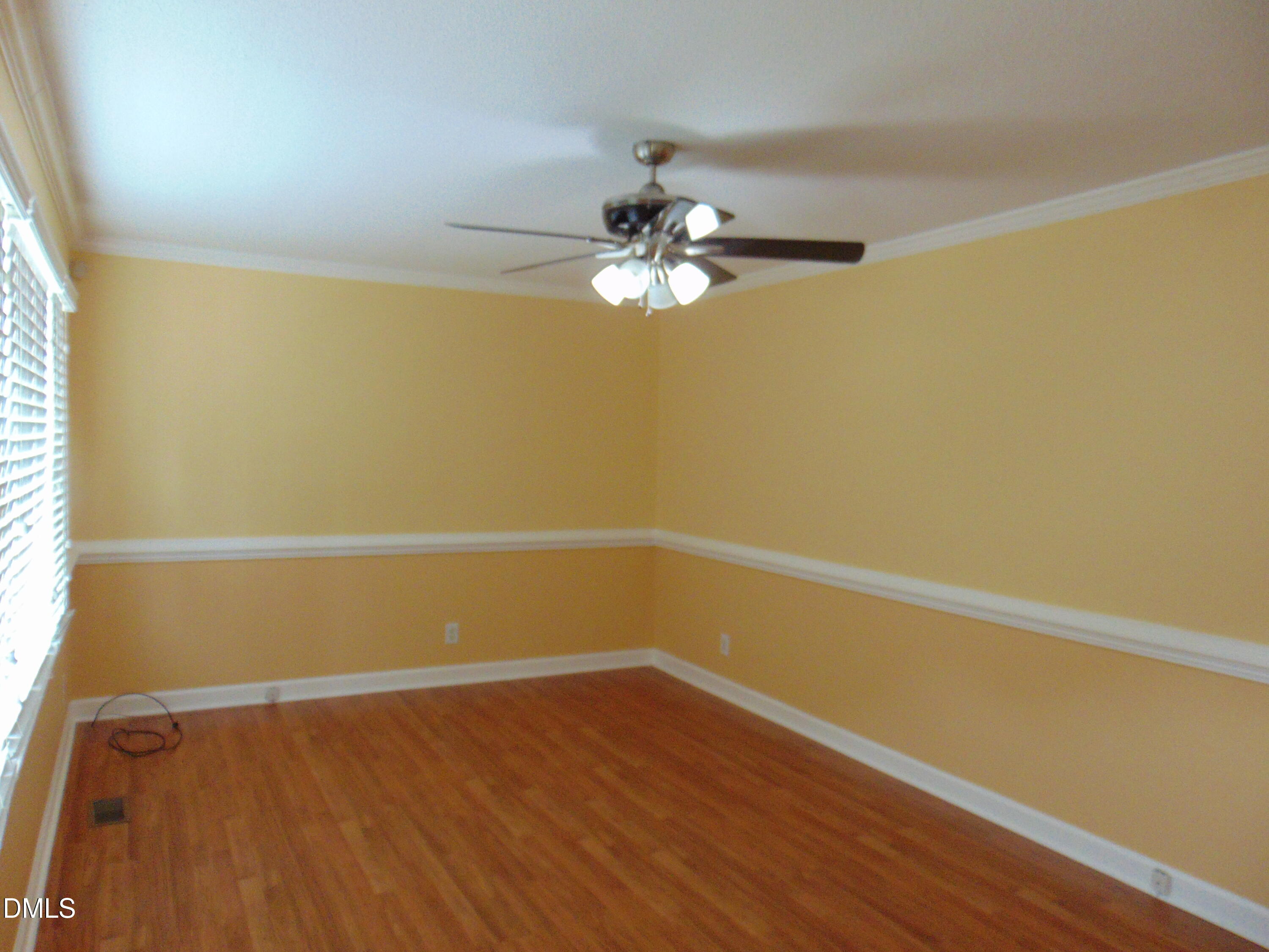442 Gus Road Durham, NC 27703 - Photo 7 of 56 a view of a room with wooden floor and a ceiling fan