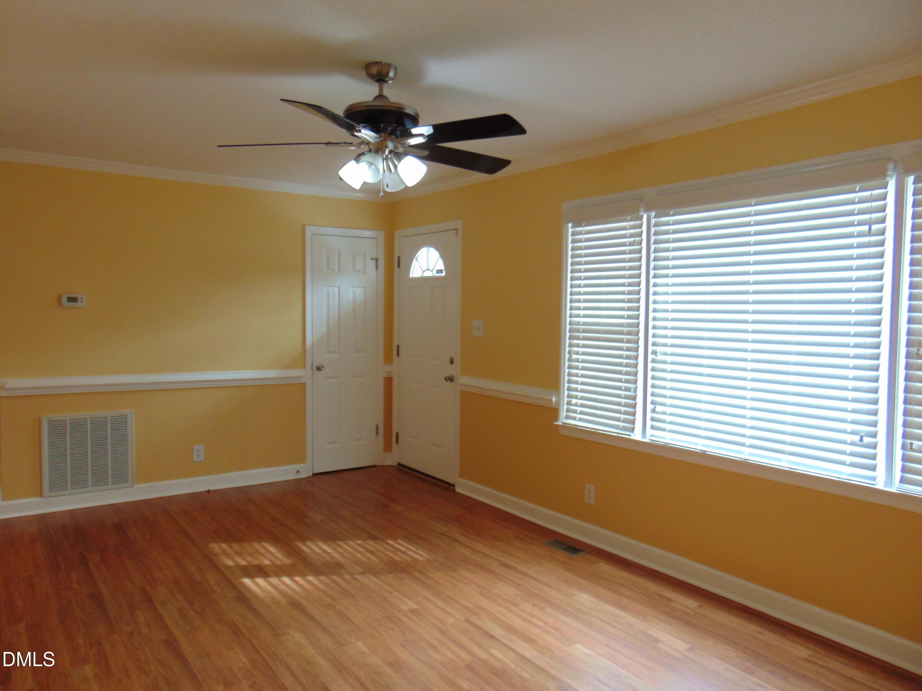442 Gus Road Durham, NC 27703 - Photo 8 of 56 a view of an empty room with a window