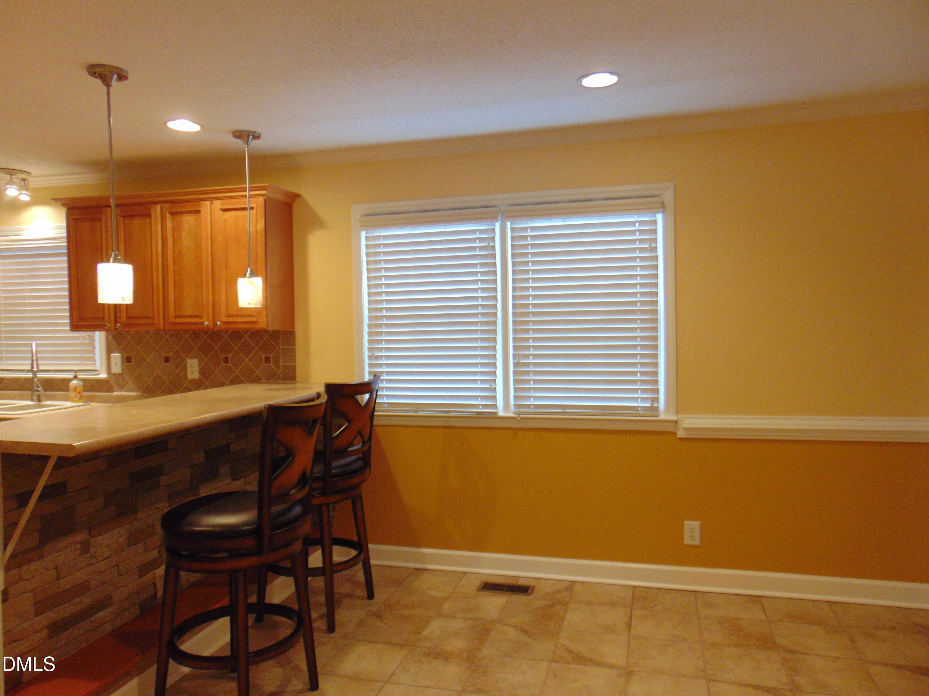 442 Gus Road Durham, NC 27703 - Photo 9 of 56 a bathroom with a sink a toilet and a shower