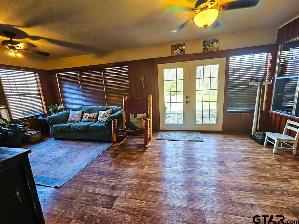 517 An County Road Palestine, TX 75801 - Photo 11 of 41 a living room with furniture a fireplace and a flat screen tv