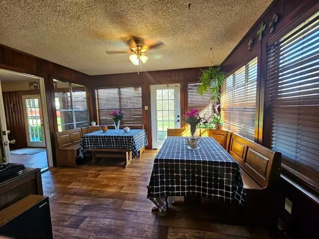 a bed room with furniture and wooden floor
