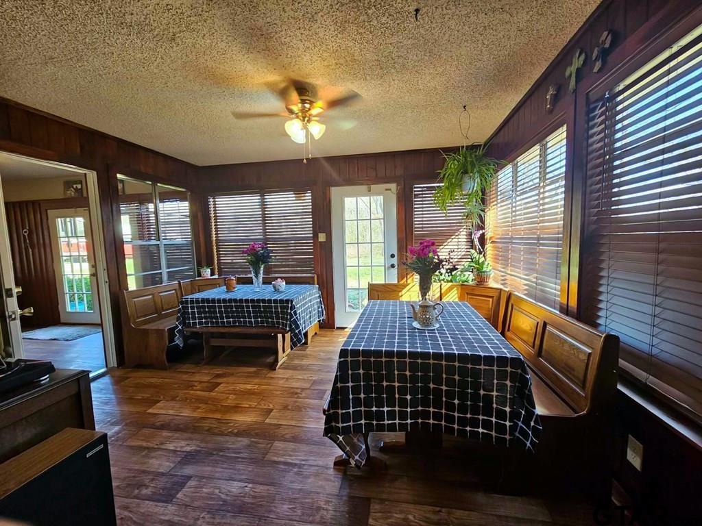 517 An County Road Palestine, TX 75801 - Photo 12 of 41 a bed room with furniture and wooden floor
