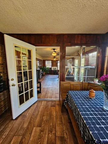 a view of a living room and wooden floor