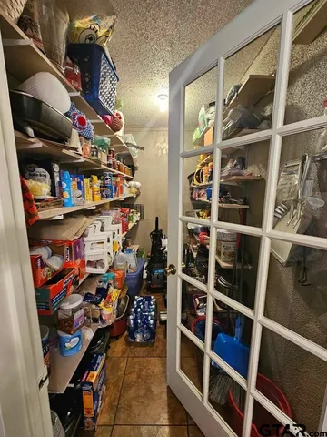 a store room with lots of different colored cloths