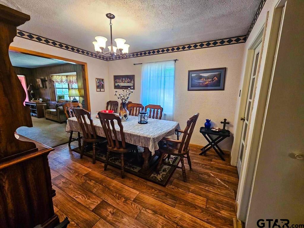 517 An County Road Palestine, TX 75801 - Photo 16 of 41 a view of a dining room with furniture window and wooden floor