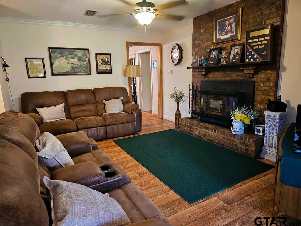 517 An County Road Palestine, TX 75801 - Photo 19 of 41 a living room with furniture and a fireplace