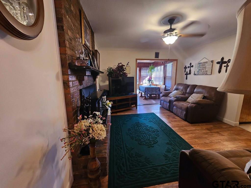 517 An County Road Palestine, TX 75801 - Photo 20 of 41 a living room with furniture a chandelier