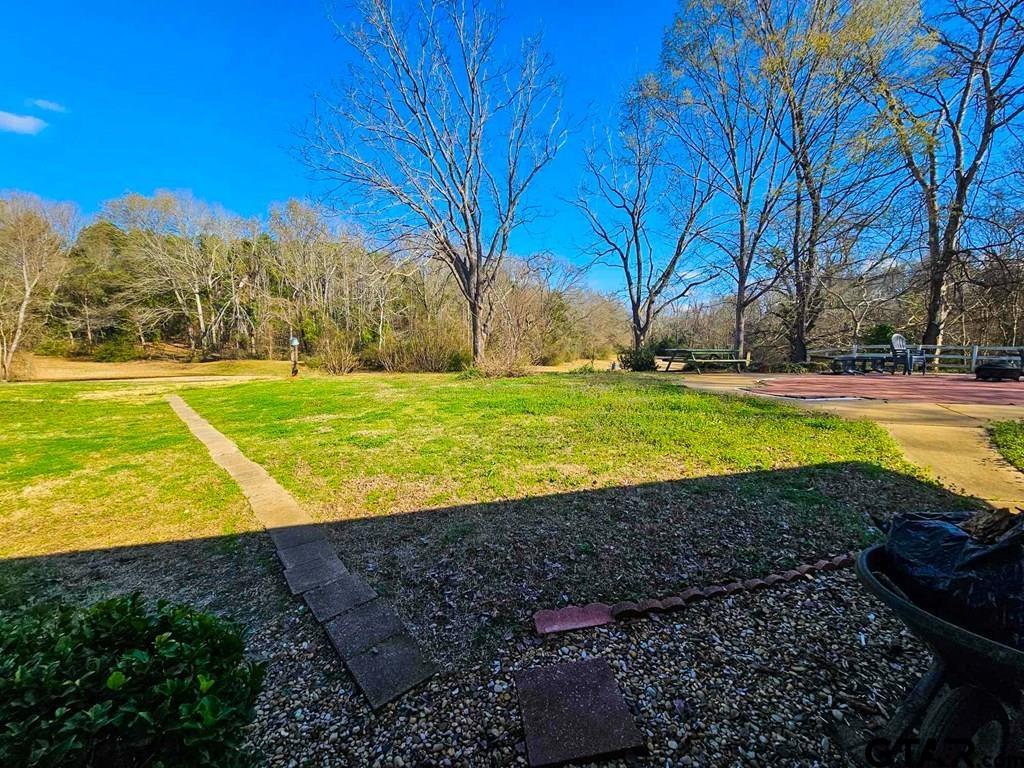 517 An County Road Palestine, TX 75801 - Photo 41 of 41 a view of a swimming pool with an outdoor space and seating area