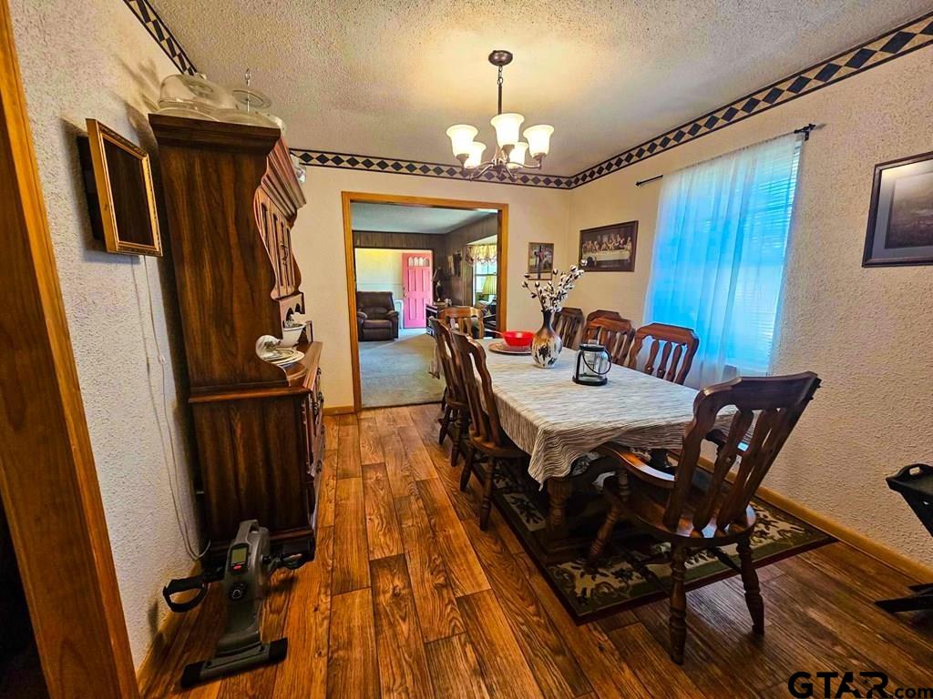 517 An County Road Palestine, TX 75801 - Photo 5 of 41 a view of a dining room with furniture and chandelier