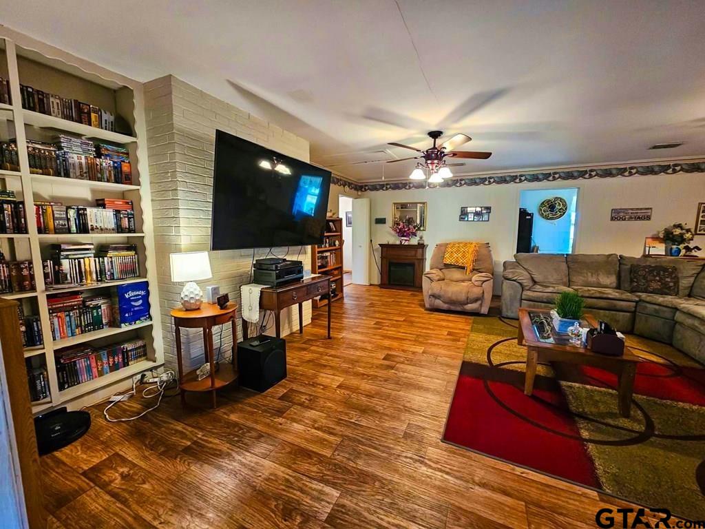 517 An County Road Palestine, TX 75801 - Photo 8 of 41 a living room with furniture and a flat screen tv