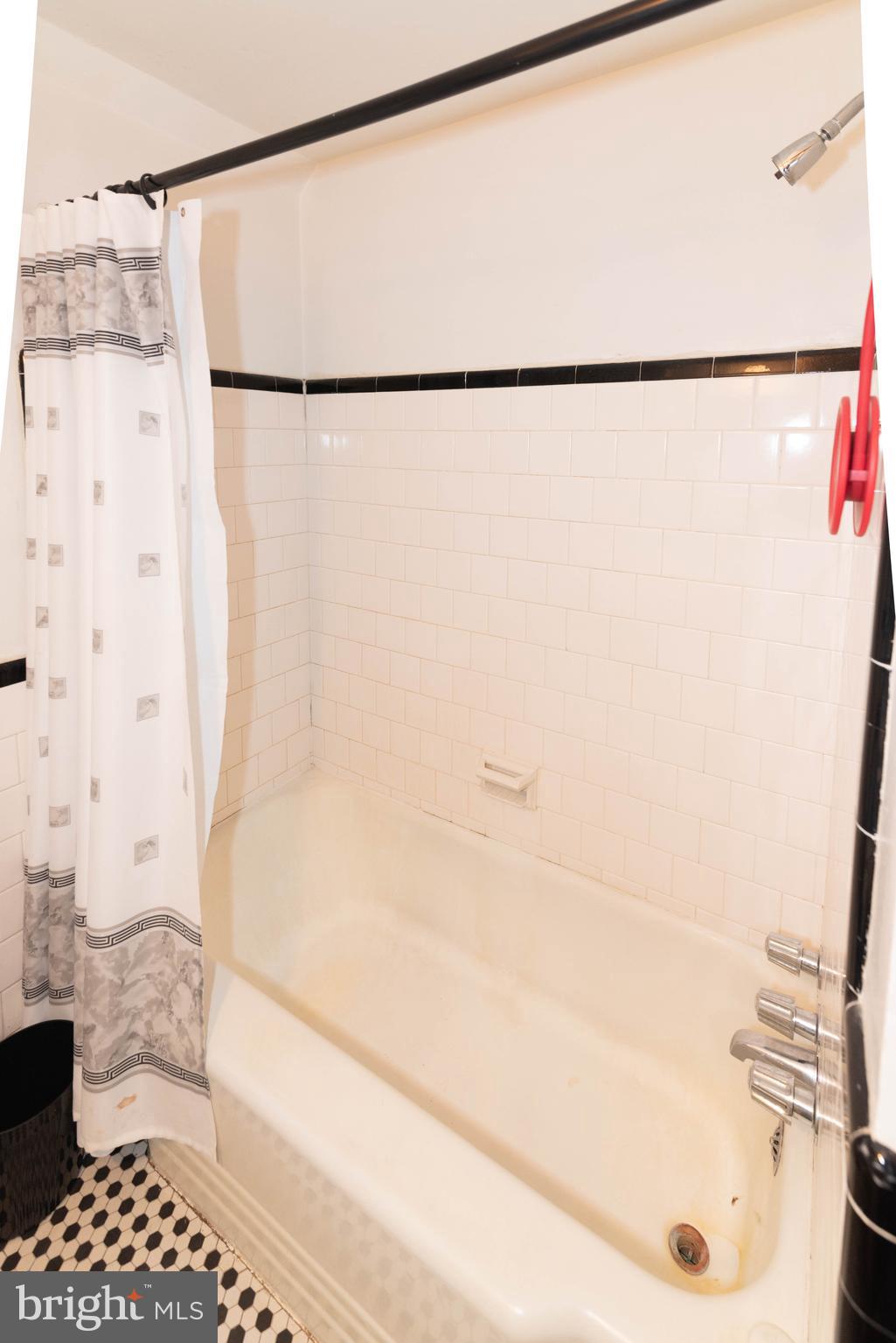 3040 Federal Street Baltimore, MD 21213 - Photo 13 of 38 a bathroom with a bathtub and a shower