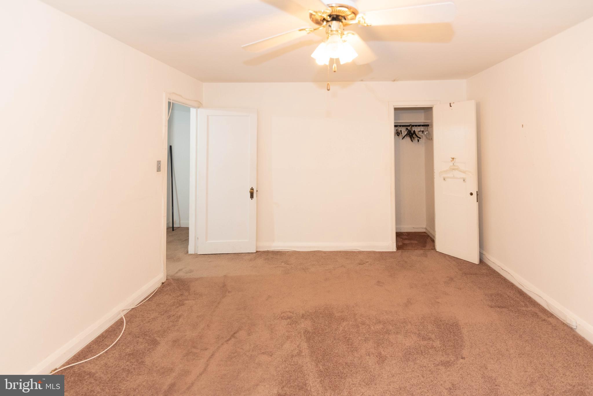 3040 Federal Street Baltimore, MD 21213 - Photo 15 of 38 a view of an empty room with a chandelier fan