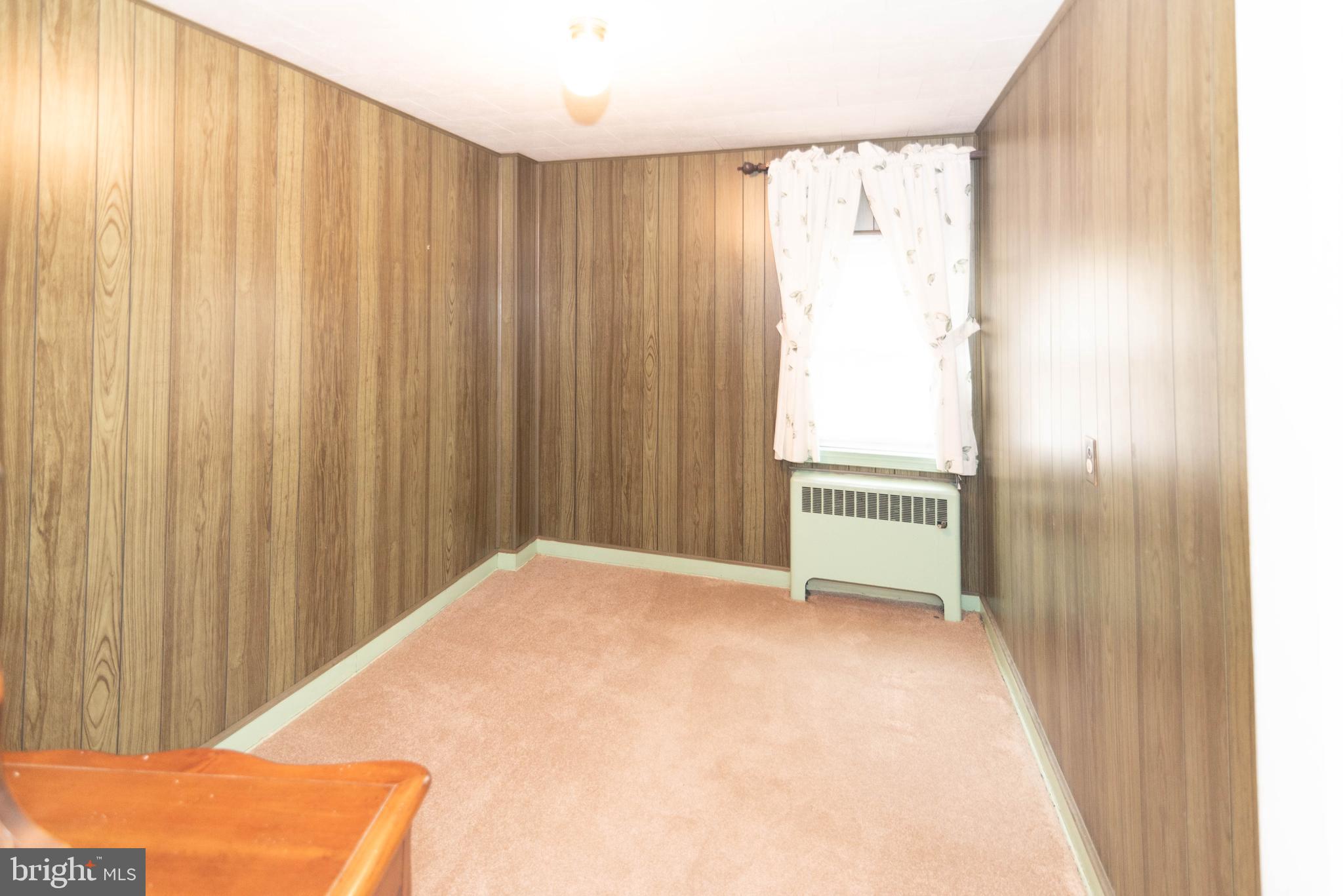 3040 Federal Street Baltimore, MD 21213 - Photo 18 of 38 a view of a big room with windows and a bed