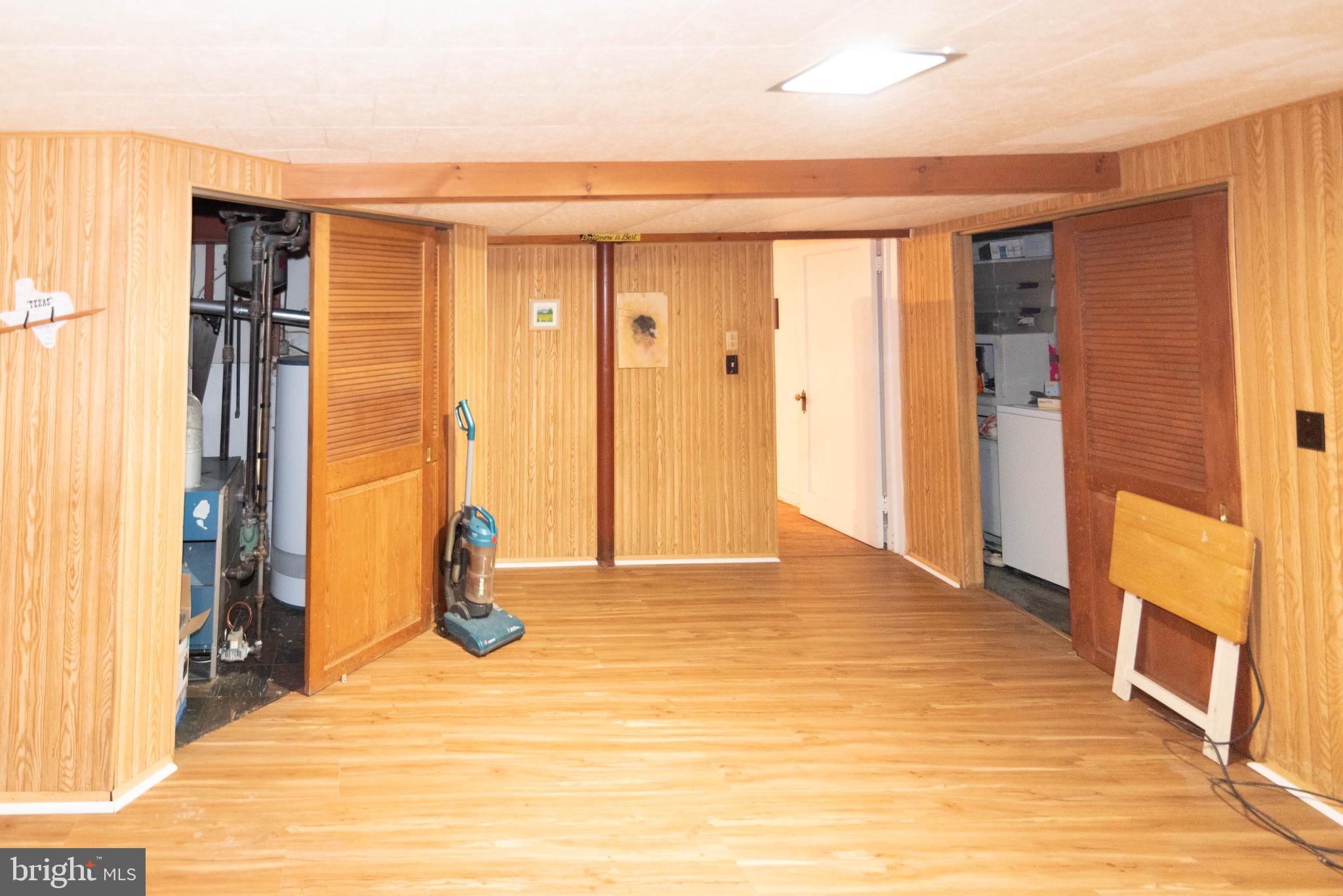 3040 Federal Street Baltimore, MD 21213 - Photo 25 of 38 a view of an empty room with wooden floor and a window