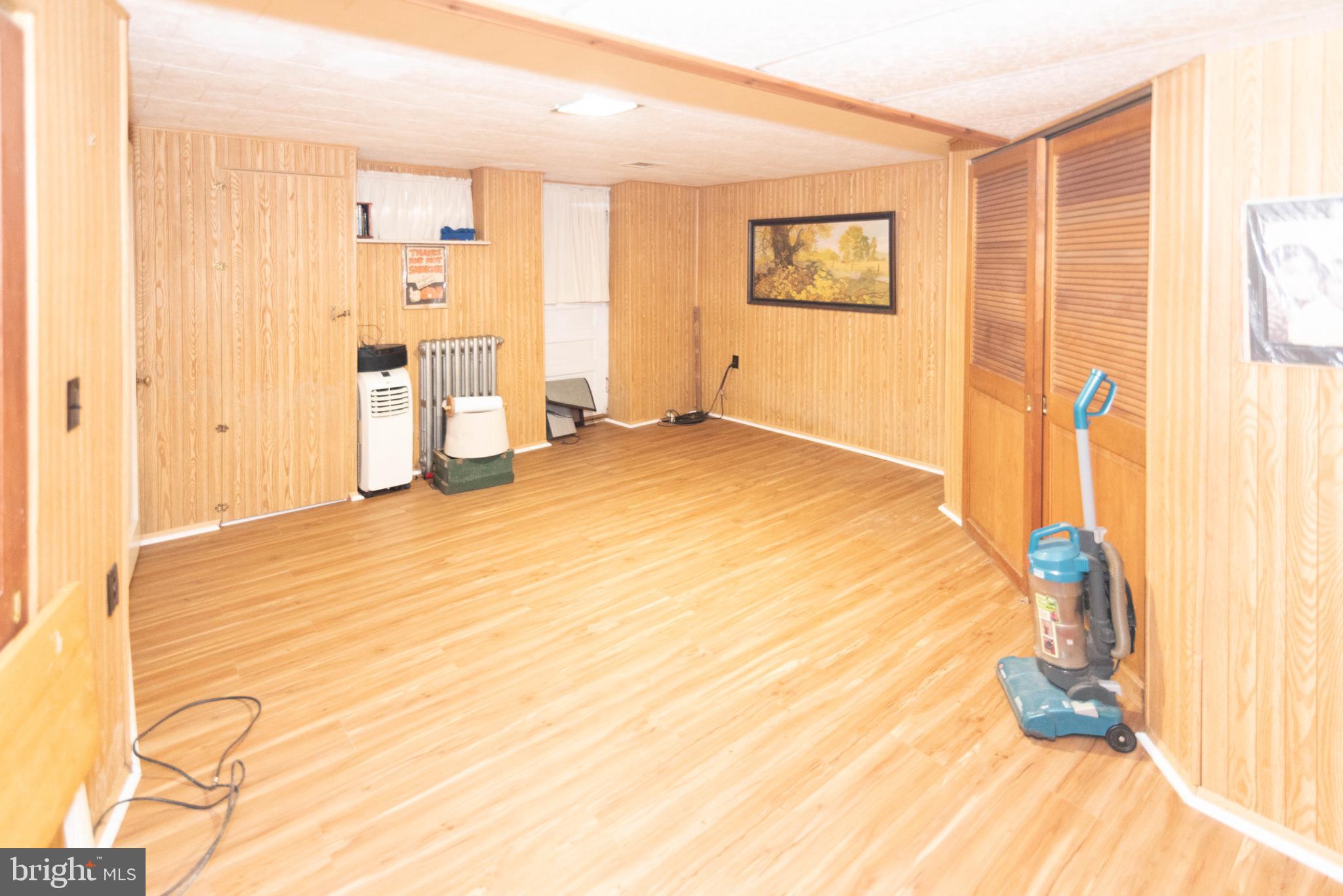 3040 Federal Street Baltimore, MD 21213 - Photo 27 of 38 a view of a livingroom with wooden floor and bedroom