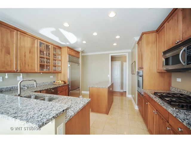 3535 Patten Road, Unit 2B Highland Park, IL 60035 - Photo 3 of 11 a kitchen with stainless steel appliances granite countertop a sink stove and cabinets