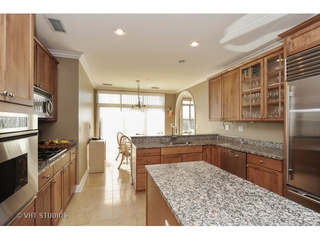 3535 Patten Road, Unit 2B Highland Park, IL 60035 - Photo 8 of 11 a kitchen with stainless steel appliances granite countertop a sink stove and refrigerator