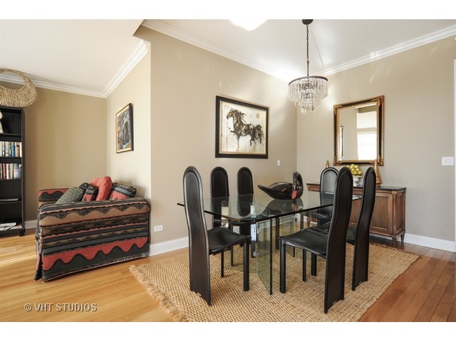 3535 Patten Road, Unit 2B Highland Park, IL 60035 - Photo 10 of 11 a view of a dining room with furniture and wooden floor