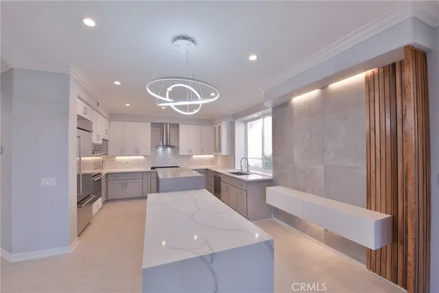 a kitchen with granite countertop a stove and a sink